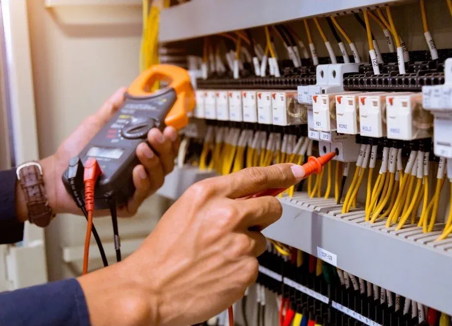 Electrician testing a distribution board